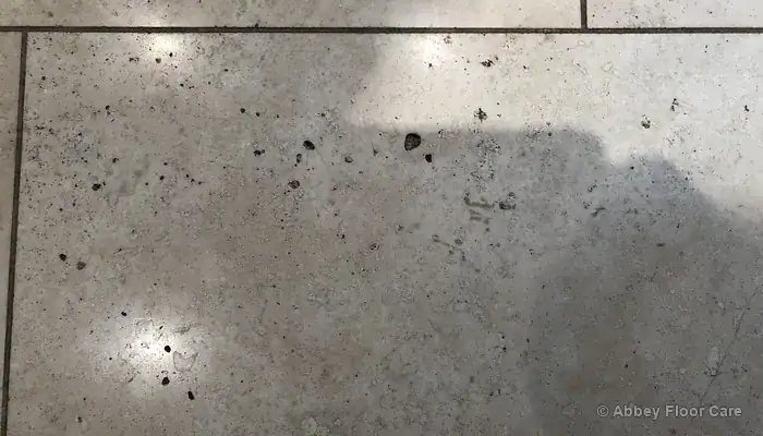 Small stable hole in a travertine tile