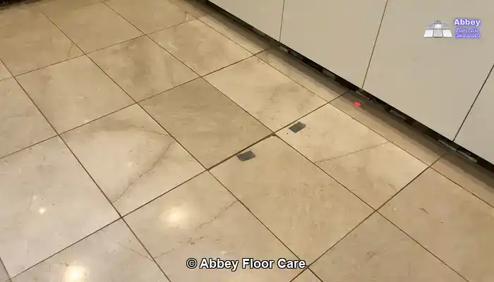Marble floor with visible wear that looks difficult to restore