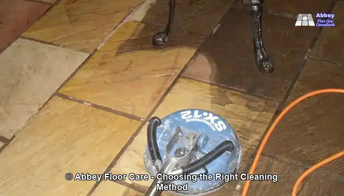 Professional rinse-and-capture cleaning equipment positioned on an indoor sandstone floor, used to remove residues and prevent re-depositing soil