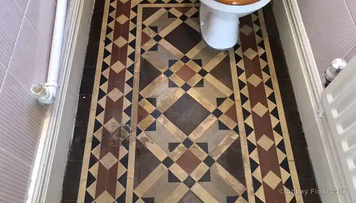 Victorian hallway tiles in a moisture-prone area where high-gloss sealers carry greater risk