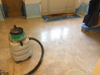 Test area showing the chosen mid-polish sheen on the limestone kitchen floor