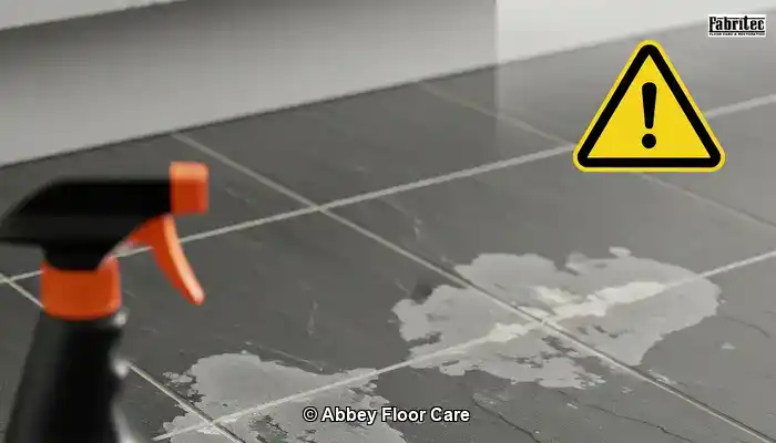 Slate floor with patchy marks caused by unsuitable cleaning products