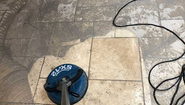 Professional rinsing and slurry extraction from a travertine floor