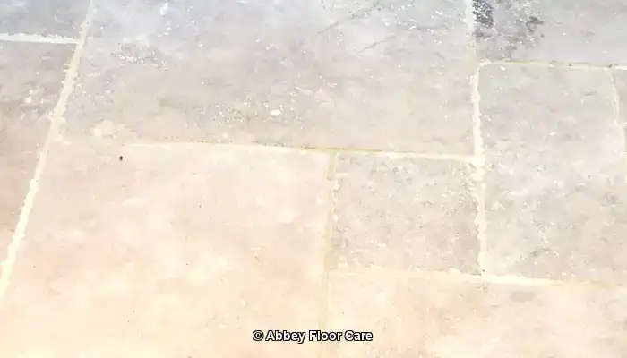 Travertine kitchen floor in Surrey after hole filling by Abbey Floor Care