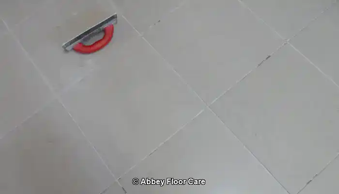 Ugly grout being replaced on porcelain tiles