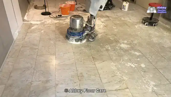 Marble floor before restoration showing heavy surface damage