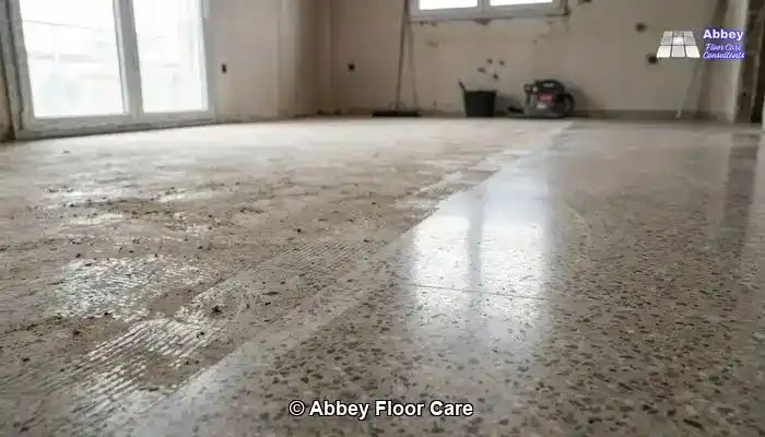 Aged terrazzo floor in a period Edinburgh room with a muted, timeworn surface.