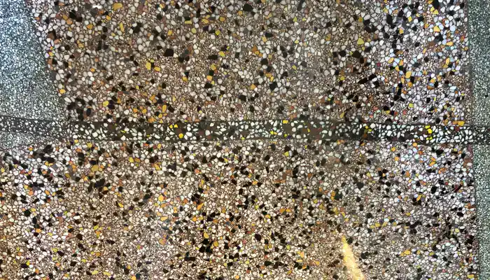 Close-up of marble chips and cement binder after professional terrazzo polishing