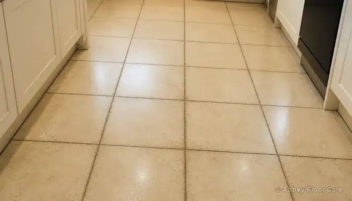 Buff porcelain tiles with darkened grout lines outlining each tile