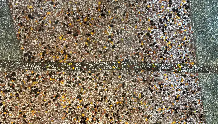 Filled crack in terrazzo floor blended before resurfacing
