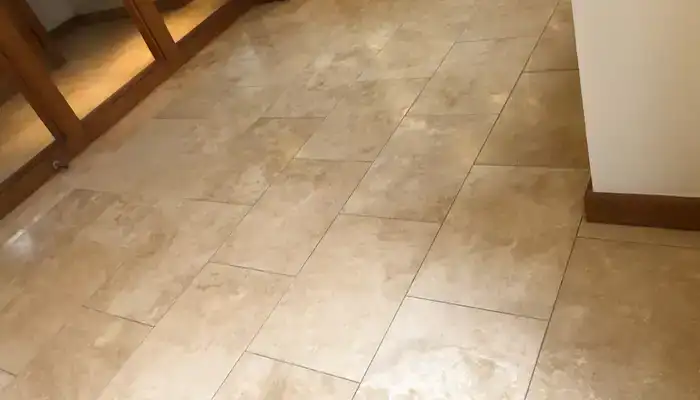 Travertine floor restored to an even natural finish with consistent surface tone